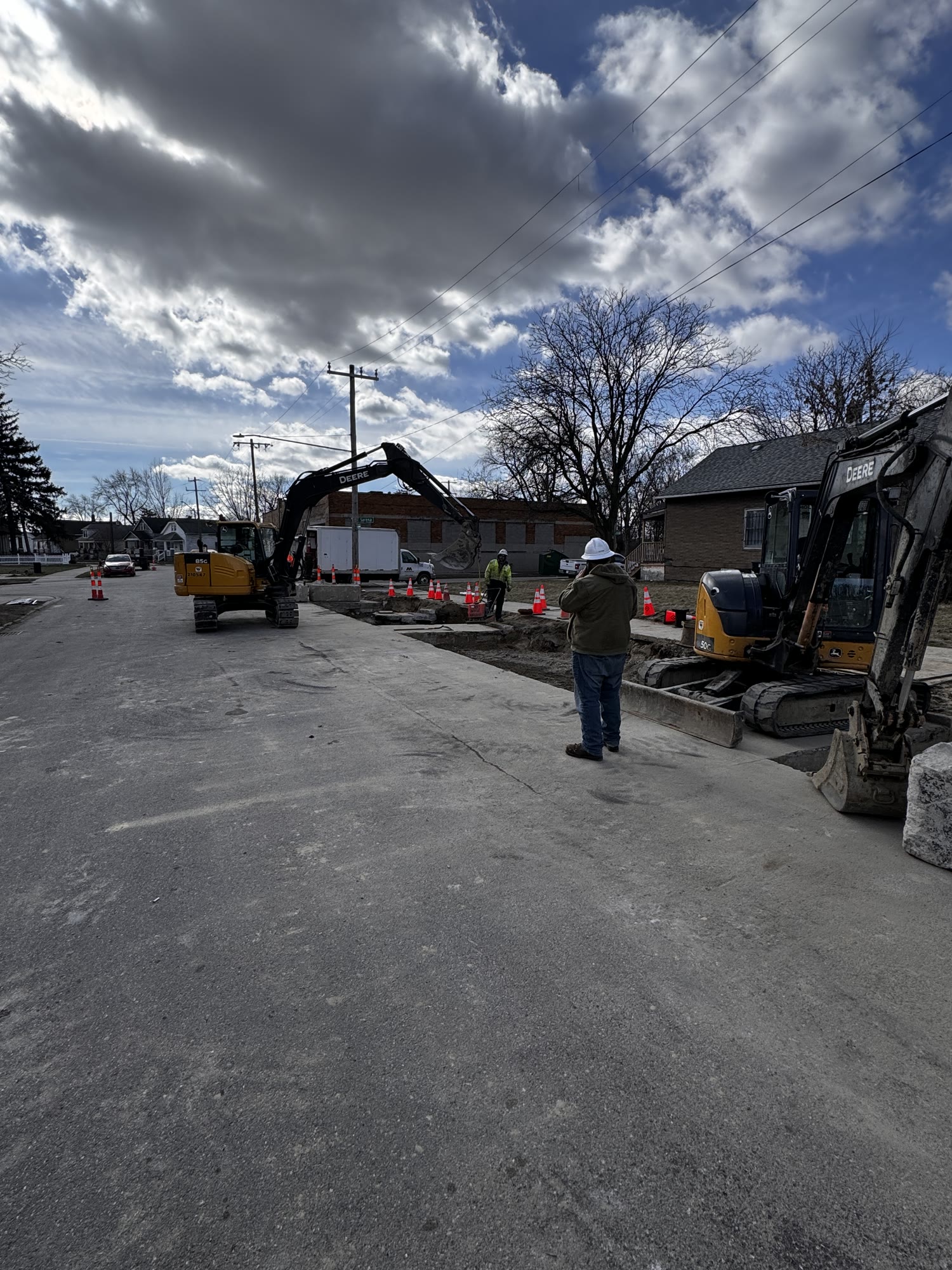 Heavy equipment and trucking performing site work in Detroit